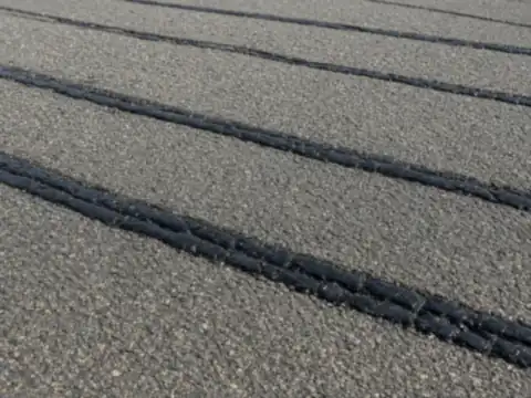Hot-pour crack sealant applied to asphalt pavement